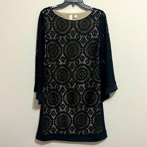 Black lace dress with nude liner and bell sleeves